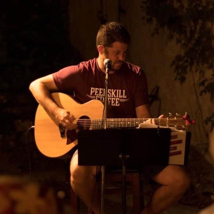 Scott Seltzer playing acoustic guitar