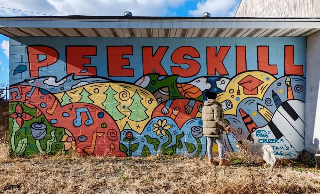 Colorful Peekskill mural on Water Street created by Brandon Cruz and Arts 10566.