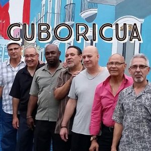 Cuboricua band in front of a colorful wall.
