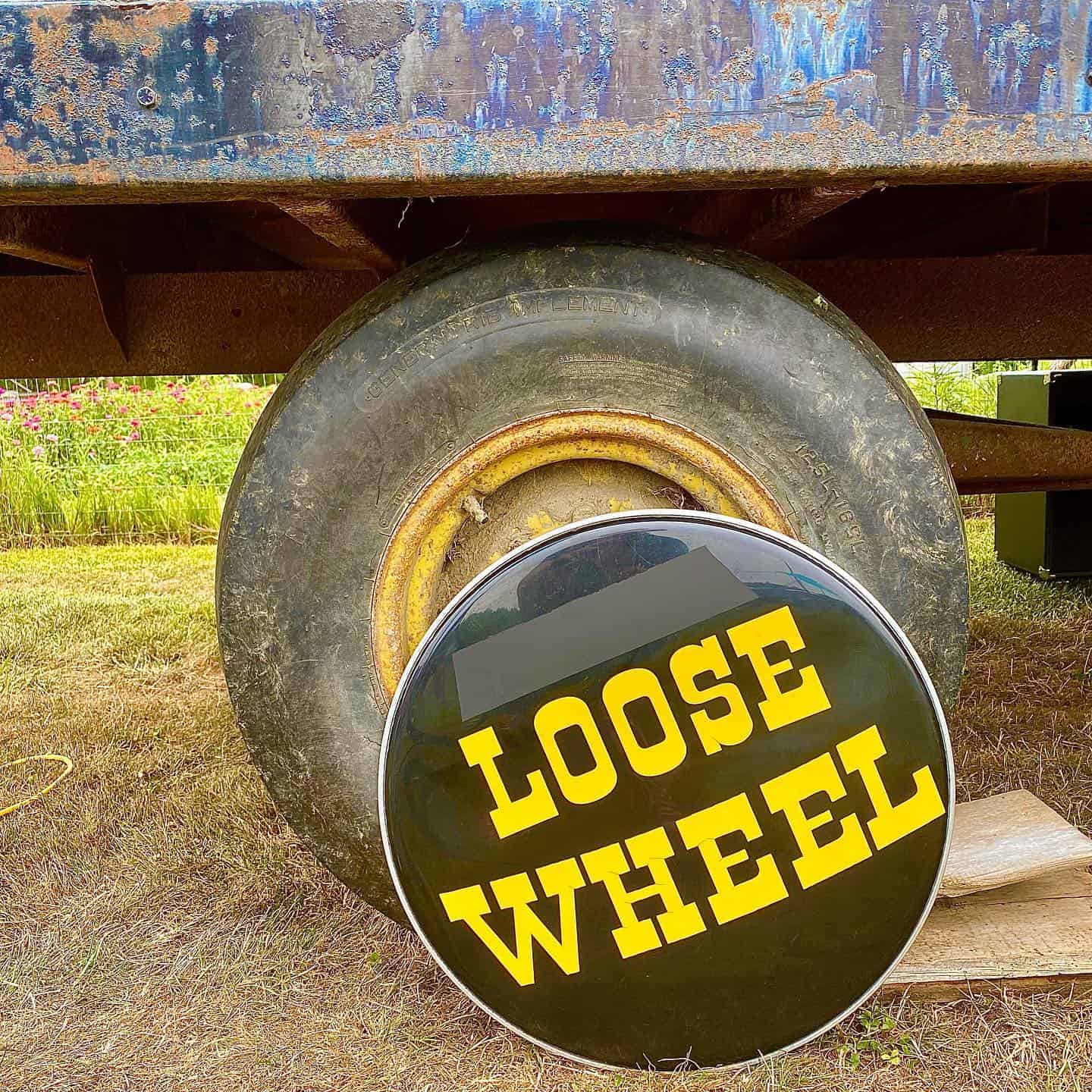 Promotion photo for the Loos Wheel Band featuring a while the the logo on it.