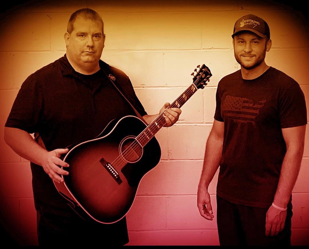 Promotion photograph of the Six-String Country duo.