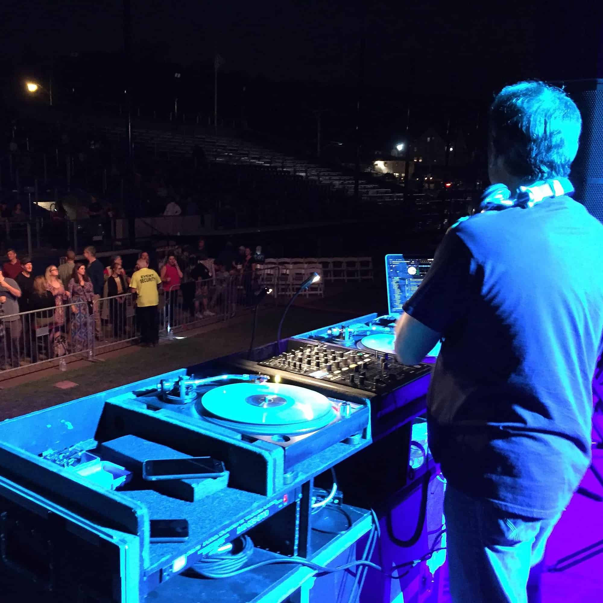 DJ Vinnie Campisi performs in front of a crowd.