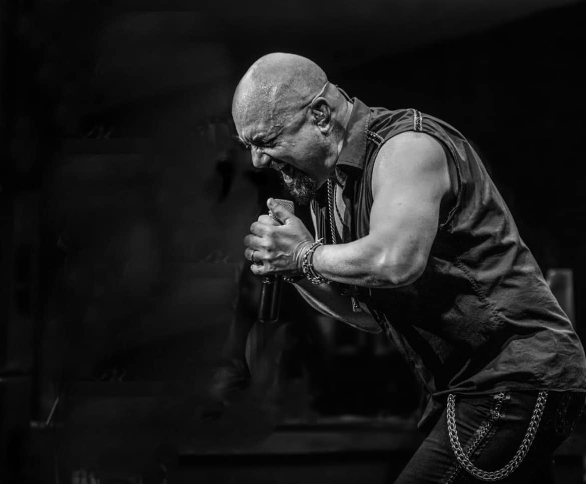 Black and White photo of Geoff Tate performing