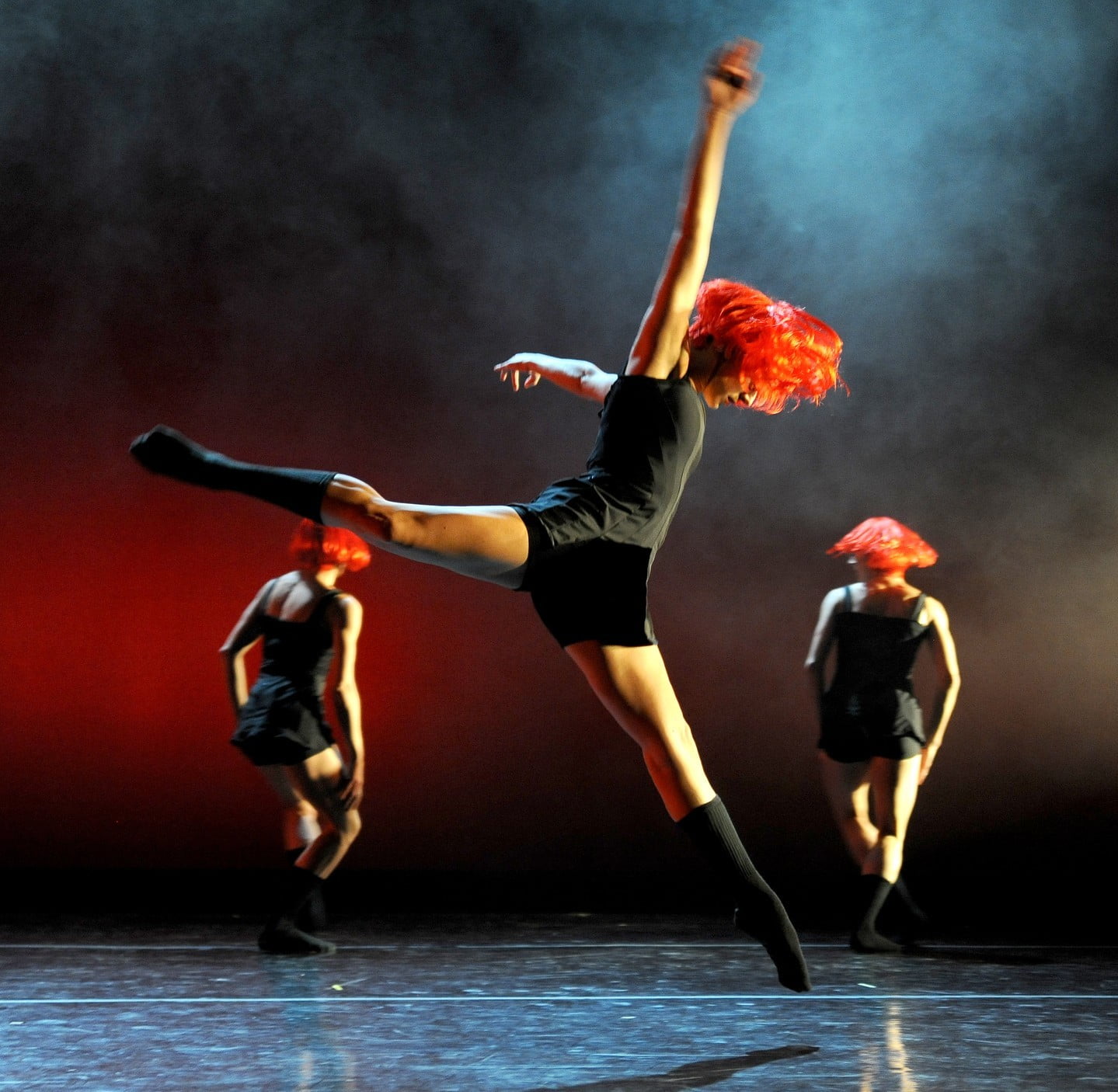 Dynamic shot of dancers from Ballet Hispánico performing on stage.