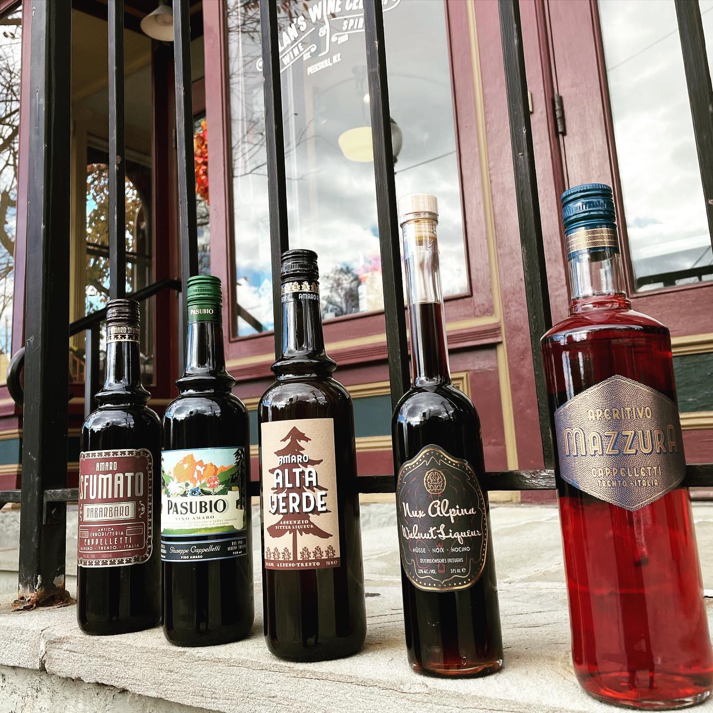 A row of liqueur bottles outside of Dylan's Wine Cellar