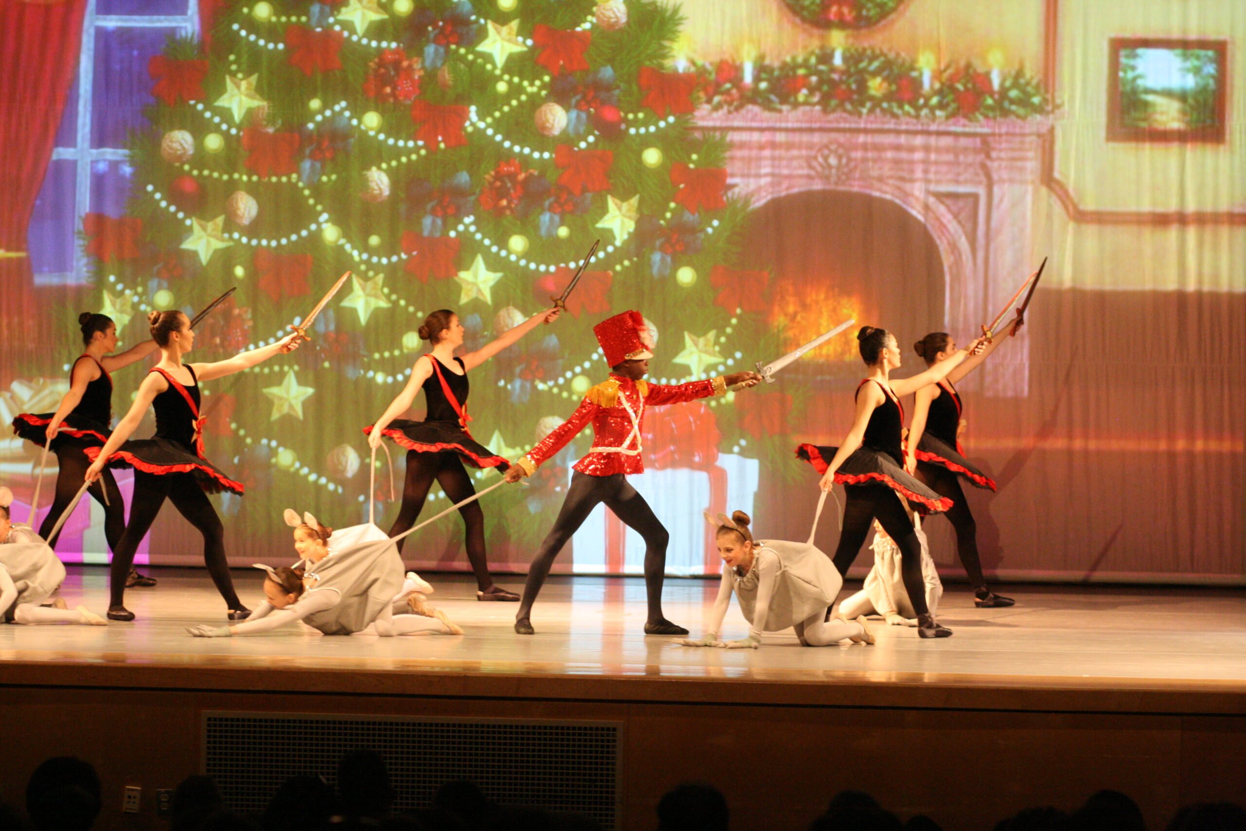 Performers in front of a Christmas tree for Nutcracker, Short & Sweet