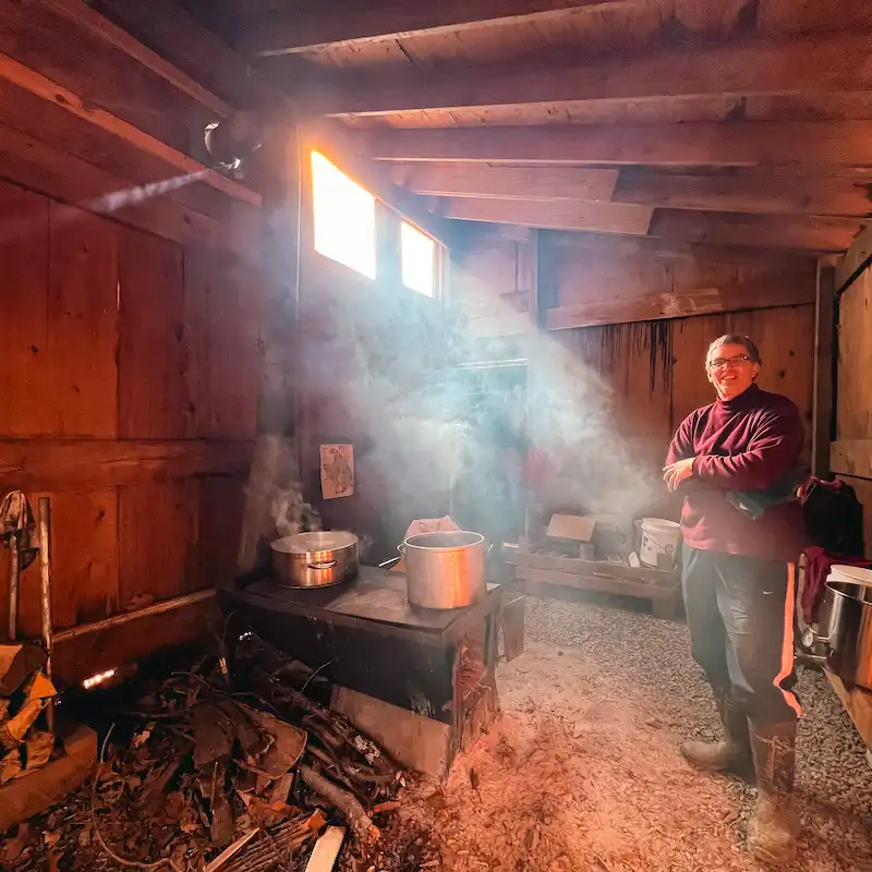 Maple syrup cook John Neering poses in the Sugar Shack at Depew Park