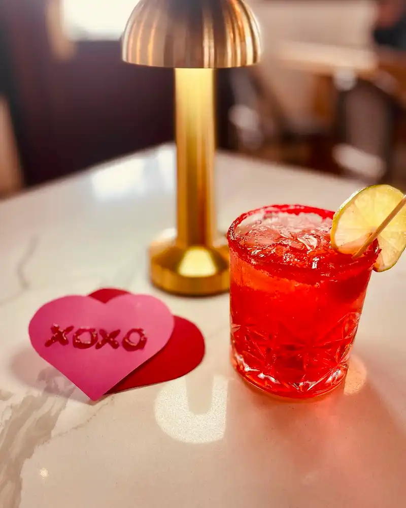 Heart shaped Valentine's aside a red cocktail at The Central lounge.