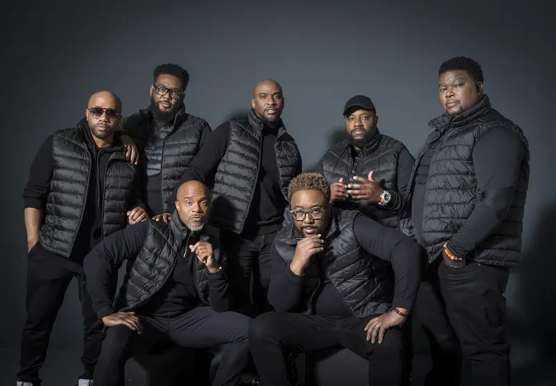 Group photograph of the music group Naturally 7