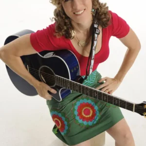 Promotion photo of Laurie Berkner with an acoustic guitar