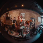 Fisheye lens shot of the band The Hec 3oh performing.